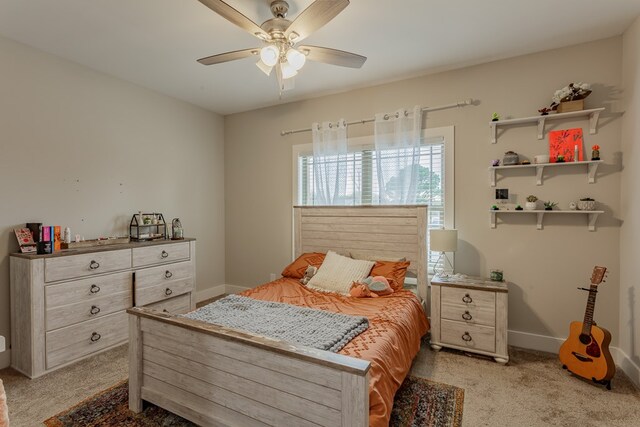 bedroom featuring light colored carpet and ceiling fan