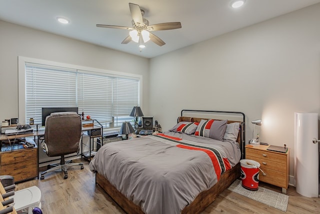 bedroom with ceiling fan and light wood-type flooring