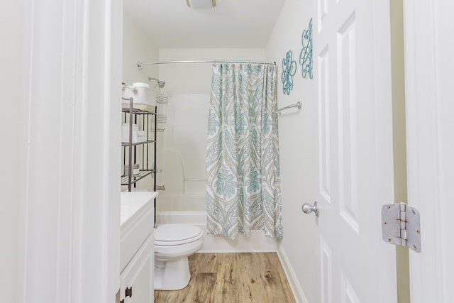 1951 Oxford Ct Unit 10, Dalton, GA 30720 - bathroom featuring wood finished floors, shower / bath combo with shower curtain, vanity, and toilet