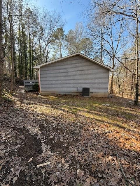 view of side of property with cooling unit