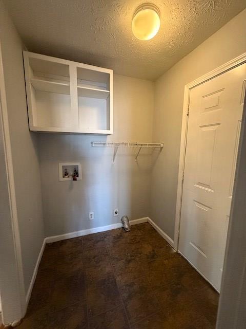 laundry room with washer hookup, a textured ceiling, and electric dryer hookup