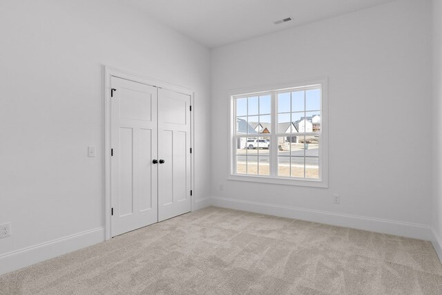 bathroom featuring vanity, tile patterned floors, and toilet