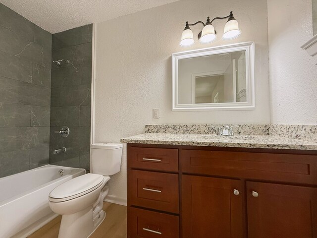 42 Travis Rd, Rossville, GA 30741 - full bathroom with toilet, wood finished floors, vanity, shower / bath combination, and a textured ceiling