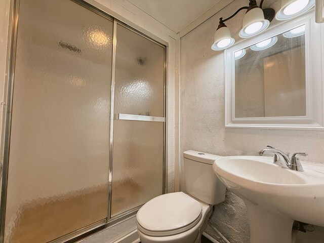 42 Travis Rd, Rossville, GA 30741 - bathroom featuring a stall shower and toilet