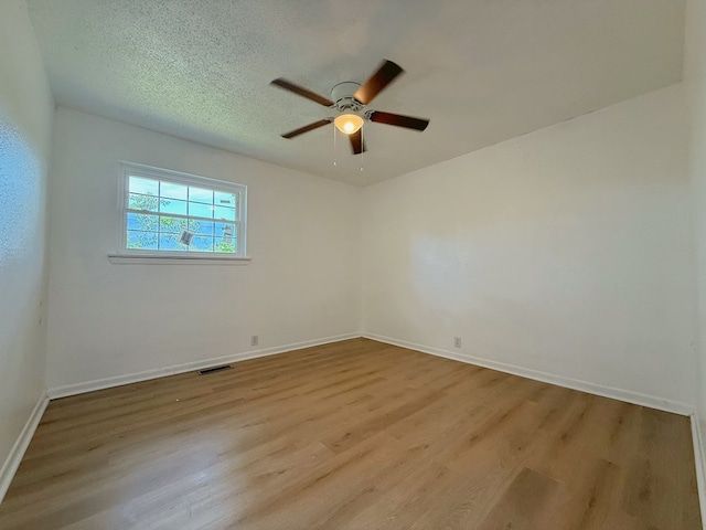 42 Travis Rd, Rossville, GA 30741 - spare room with a ceiling fan, wood finished floors, and baseboards