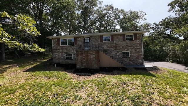42 Travis Rd, Rossville, GA 30741 - back of property with a yard and brick siding