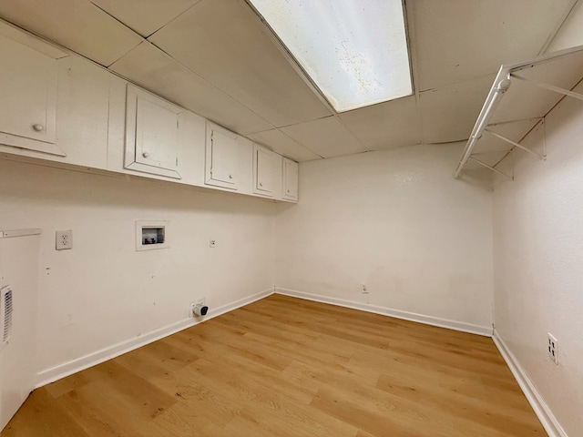 42 Travis Rd, Rossville, GA 30741 - laundry room with washer hookup, cabinet space, baseboards, and light wood-type flooring