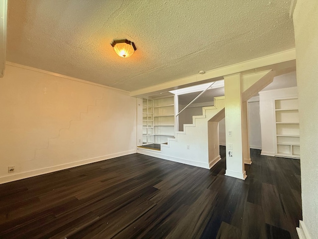 42 Travis Rd, Rossville, GA 30741 - unfurnished living room featuring stairway, a textured ceiling, built in features, dark wood-style floors, and baseboards