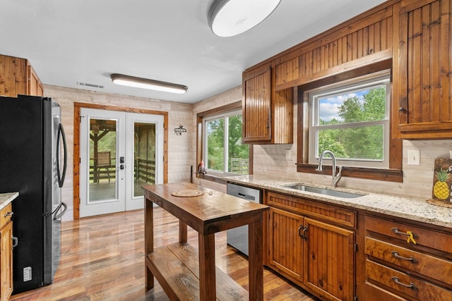 5120 Cleveland Hwy, Cohutta, GA 30710 - kitchen with freestanding refrigerator, dishwasher, tasteful backsplash, and french doors