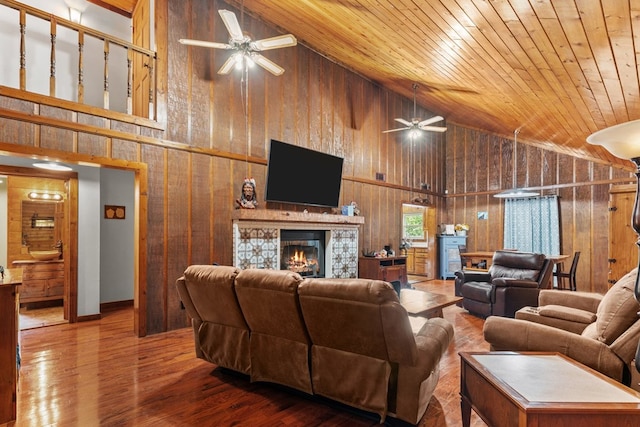 5120 Cleveland Hwy, Cohutta, GA 30710 - living area featuring high vaulted ceiling, wood walls, a ceiling fan, wood finished floors, and a fireplace