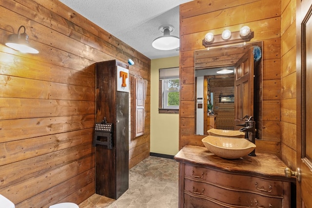 5120 Cleveland Hwy, Cohutta, GA 30710 - bathroom featuring wood walls, vanity, and a textured ceiling