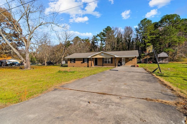 ranch-style home featuring a front yard and a carport