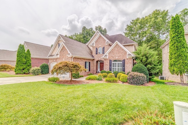1909 Keystone Way, Dalton, GA 30720 - view of front of house with brick siding, concrete driveway, a front yard, and roof with shingles