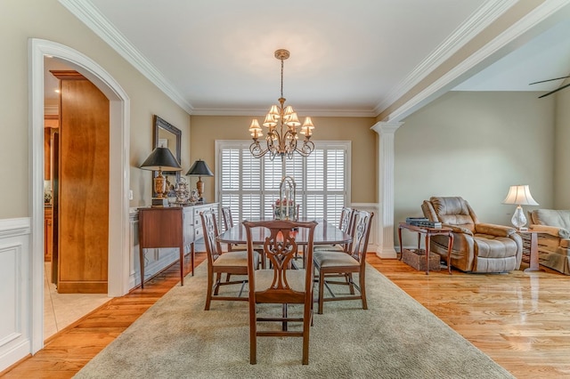 1909 Keystone Way, Dalton, GA 30720 - dining space with a chandelier, crown molding, arched walkways, light wood finished floors, and a wainscoted wall
