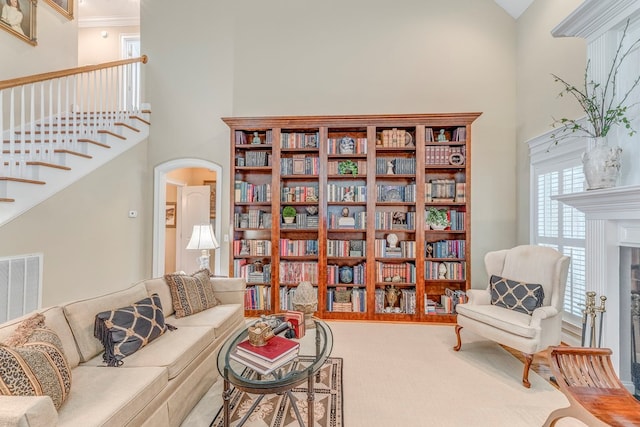 1909 Keystone Way, Dalton, GA 30720 - sitting room featuring a high ceiling, carpet floors, arched walkways, stairway, and ornamental molding