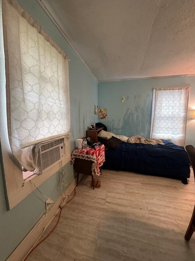 116 Butterfield Dr, Dalton, GA 30721 - bedroom featuring crown molding, a textured ceiling, and cooling unit