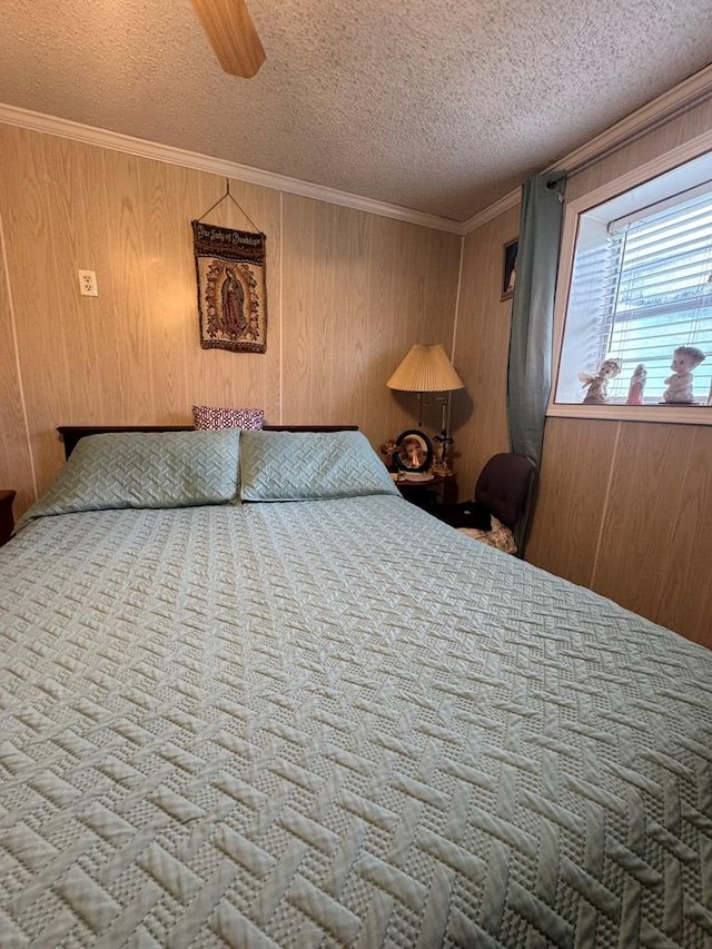 116 Butterfield Dr, Dalton, GA 30721 - bedroom with a textured ceiling, ceiling fan, wood walls, and ornamental molding