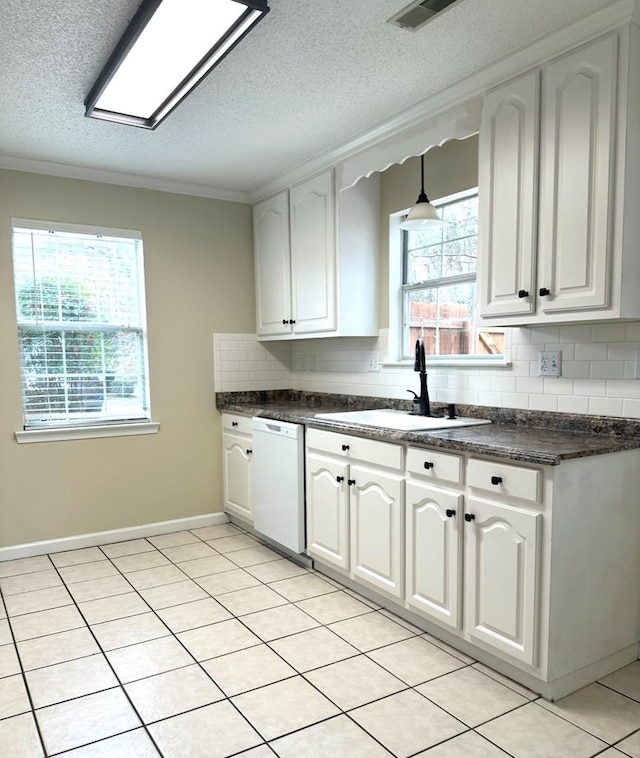 kitchen with white cabinetry, sink, pendant lighting, and white dishwasher