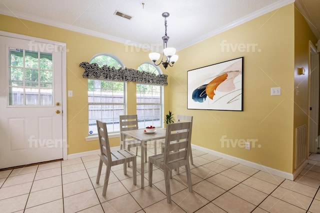 dining area featuring crown molding, a chandelier, a healthy amount of sunlight, and light tile patterned flooring