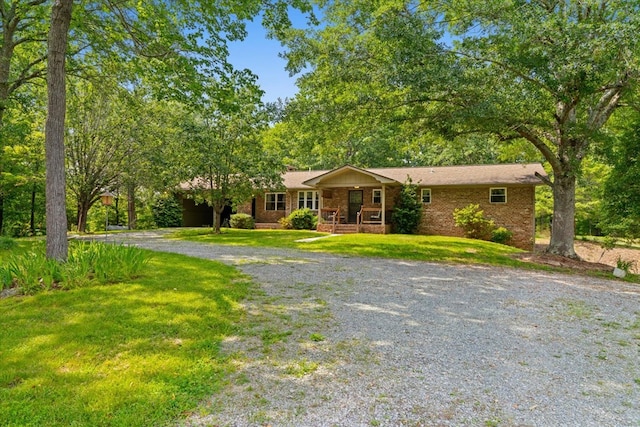 3932 Tibbs Bridge Rd, Dalton, GA 30721 - single story home featuring a porch, a front lawn, and brick siding