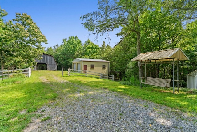 3932 Tibbs Bridge Rd, Dalton, GA 30721 - view of yard with an outdoor structure and a barn