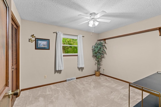 3932 Tibbs Bridge Rd, Dalton, GA 30721 - spare room with ceiling fan, carpet floors, and a textured ceiling