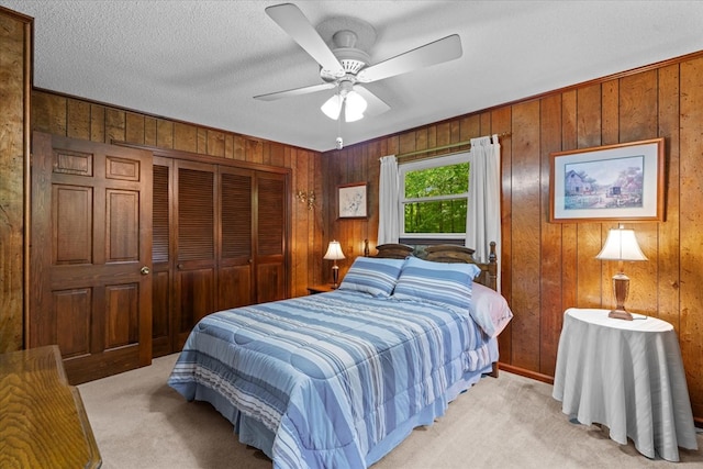 3932 Tibbs Bridge Rd, Dalton, GA 30721 - bedroom featuring wood walls, light colored carpet, a closet, and ceiling fan