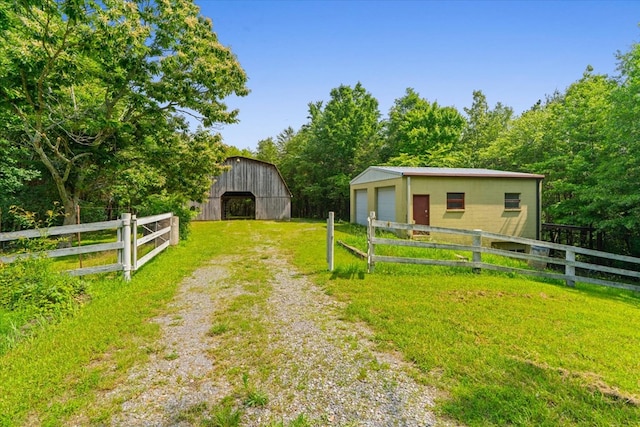 3932 Tibbs Bridge Rd, Dalton, GA 30721 - view of yard featuring a barn, an outbuilding, and a garage