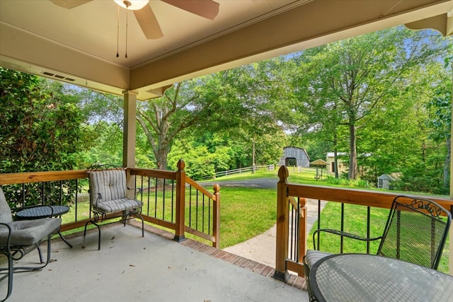 3932 Tibbs Bridge Rd, Dalton, GA 30721 - view of patio featuring a ceiling fan, view of wooded area, and an outdoor structure