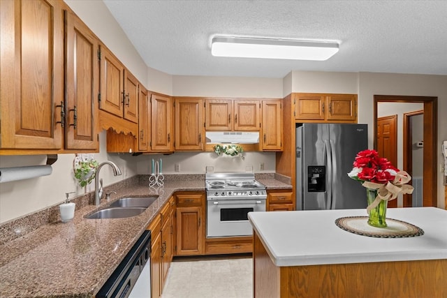 3932 Tibbs Bridge Rd, Dalton, GA 30721 - kitchen featuring stainless steel fridge, under cabinet range hood, electric range, dishwasher, and brown cabinetry