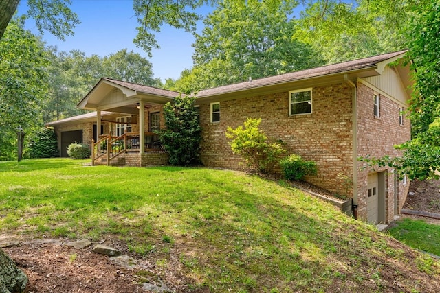 3932 Tibbs Bridge Rd, Dalton, GA 30721 - view of front facade featuring brick siding, covered porch, a front yard, and a garage
