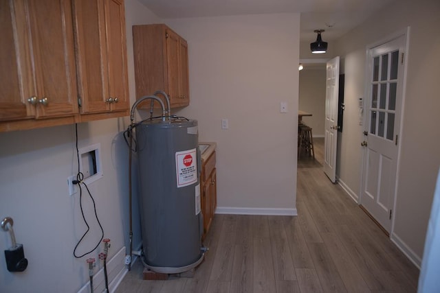 utility room with electric water heater