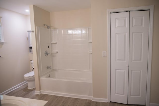 full bathroom featuring vanity, wood-type flooring, tub / shower combination, and toilet