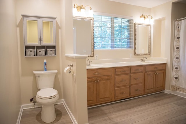 bathroom featuring vanity, hardwood / wood-style flooring, a shower with curtain, and toilet