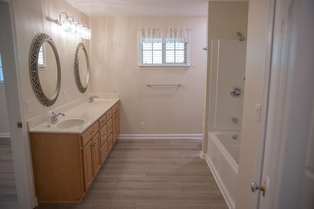 bathroom featuring hardwood / wood-style flooring and vanity