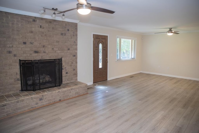 unfurnished living room with a brick fireplace, light hardwood / wood-style flooring, ornamental molding, and ceiling fan