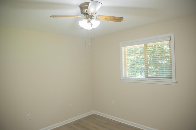 unfurnished room with wood-type flooring and ceiling fan