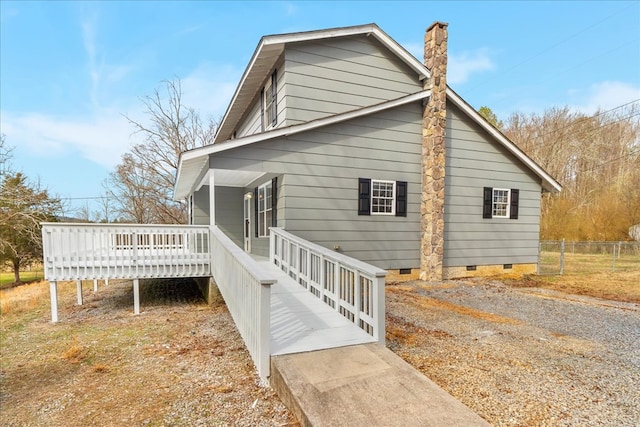 view of property exterior with crawl space, a chimney, and fence