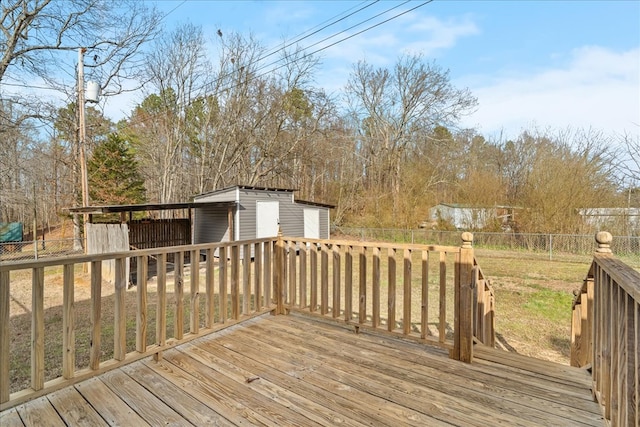 wooden terrace with an outbuilding