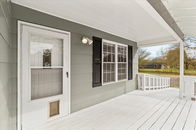 wooden terrace with a porch