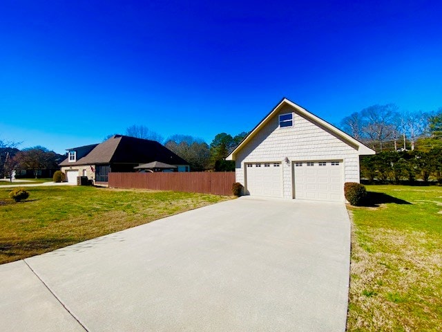 view of property exterior with a yard and fence