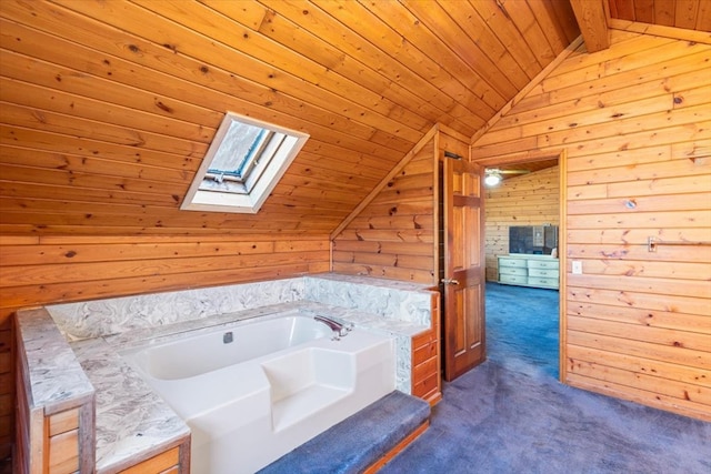 bathroom with wood ceiling, vaulted ceiling with skylight, wooden walls, and a bath