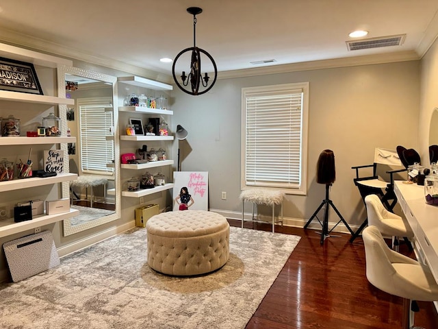 living area featuring crown molding, dark hardwood / wood-style floors, and a notable chandelier