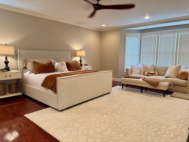 bedroom with crown molding, hardwood / wood-style flooring, and ceiling fan