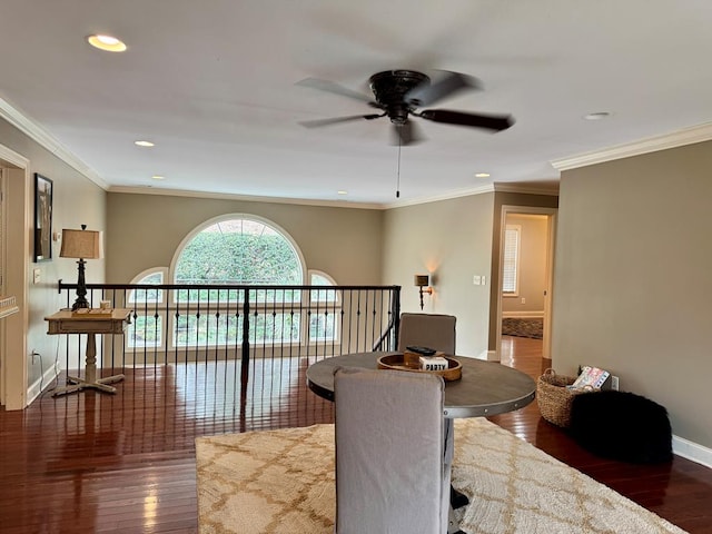 hall with ornamental molding and dark hardwood / wood-style floors