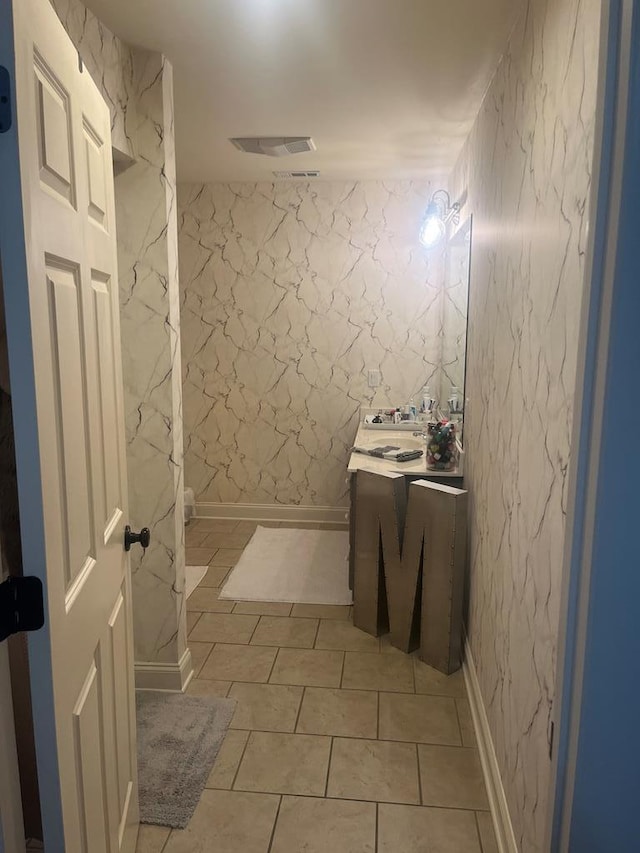 bathroom with vanity and tile patterned floors