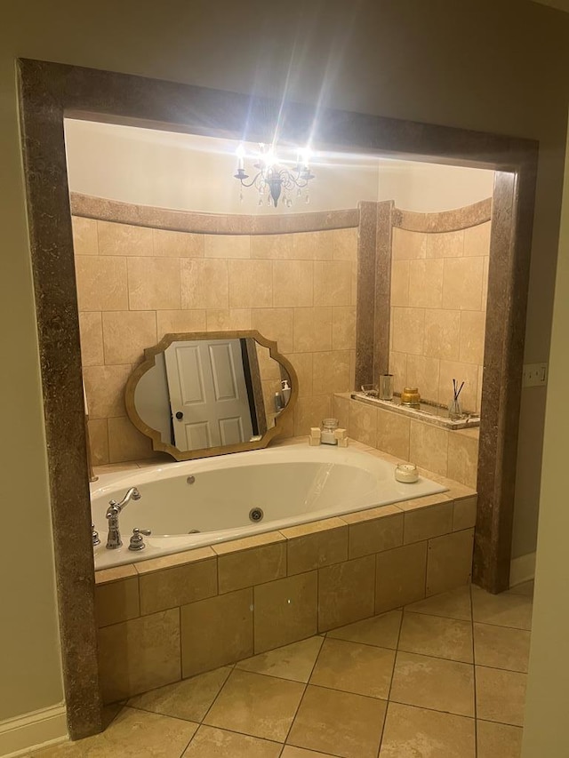 bathroom with tile patterned flooring and tiled bath