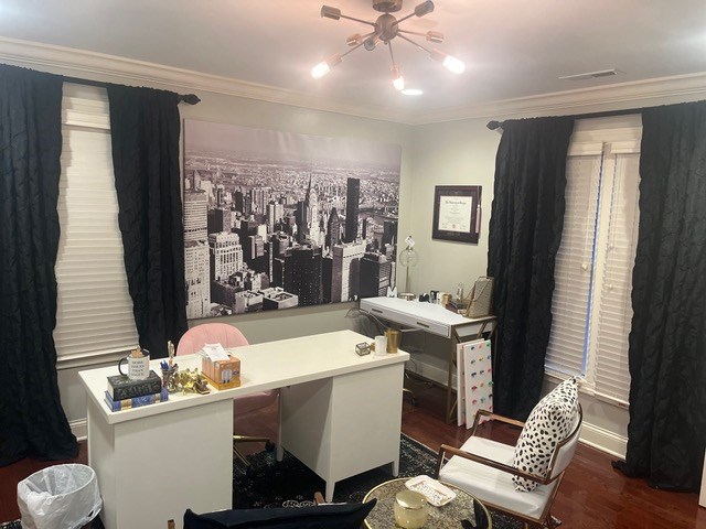 office space with crown molding and dark hardwood / wood-style flooring