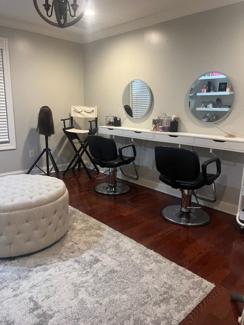 home office with crown molding and dark hardwood / wood-style floors