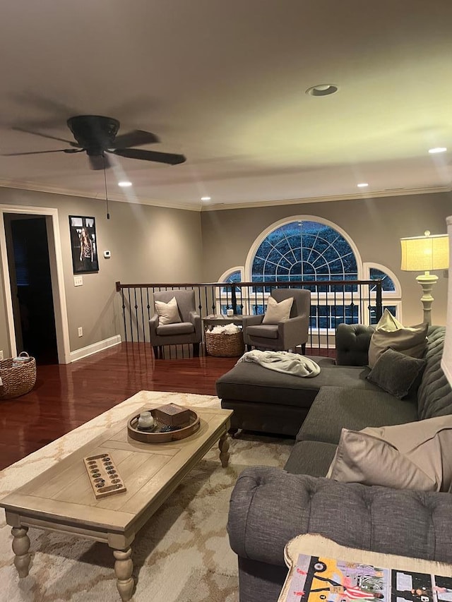 living room with wood-type flooring and ornamental molding